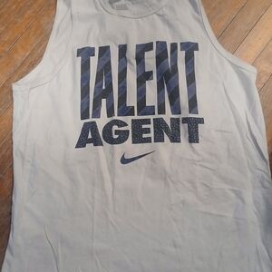 Nike White Tank Top with Navy Blue 'Talent Agent' Graphic